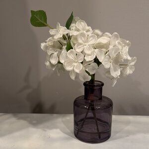 Elegant White Floral Arrangement in Purple Glass Vase